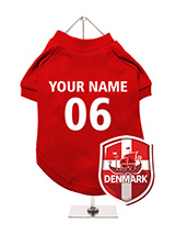 Denmark Football Dog T-Shirt (Personalised) - Support Denmark with this unique dog t-shirt, featuring a customisable design. The t-shirt showcases a Denmark-themed crest with a Viking ship and can be personalised with your dog's name and team number. Crafted from breathable, cosy fabric, it keeps your dog comfortable. It's also machine washable...