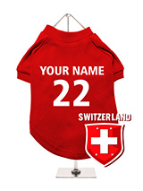 Switzerland Football Dog T-Shirt (Personalised) - Celebrate Switzerland with this customisable dog t-shirt, featuring a unique Switzerland cross crest. Personalise it with your dog's name and team number for a custom look. The t-shirt is made from comfortable, breathable fabric. Its easy to care for with machine washability. Ideal for showing your...